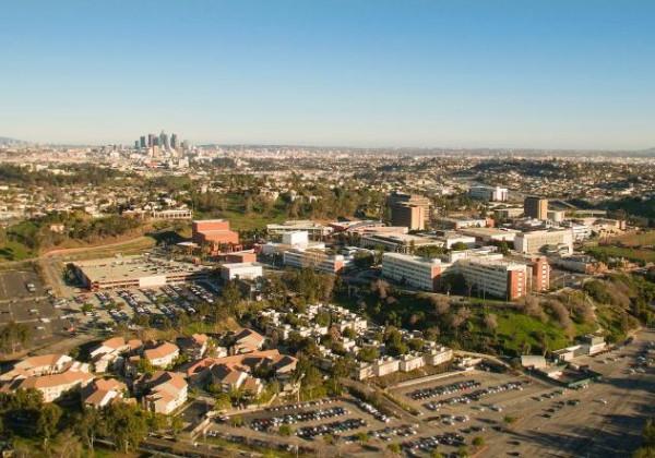 aerial drone view of Cal State LA campus with overview of Los Angeles and view of 10 freeway